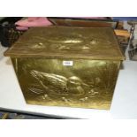 A brass covered Slipper box with duck and ducklings decoration.