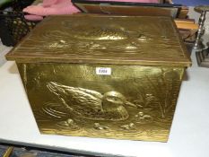 A brass covered Slipper box with duck and ducklings decoration.