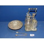 A plated cruet stand with glass condiments,