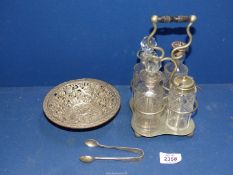 A plated cruet stand with glass condiments,