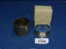 Two Silver Napkin rings, one boxed for Birmingham, the other badly rubbed, 30.3g total.