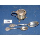 A Silver mustard pot on three pawed feet with blue liner, Birmingham and two teaspoons,