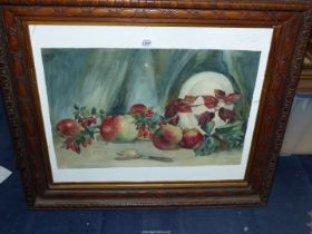 A carved wooden framed watercolour depicting a stiff life with apples and rosehips,