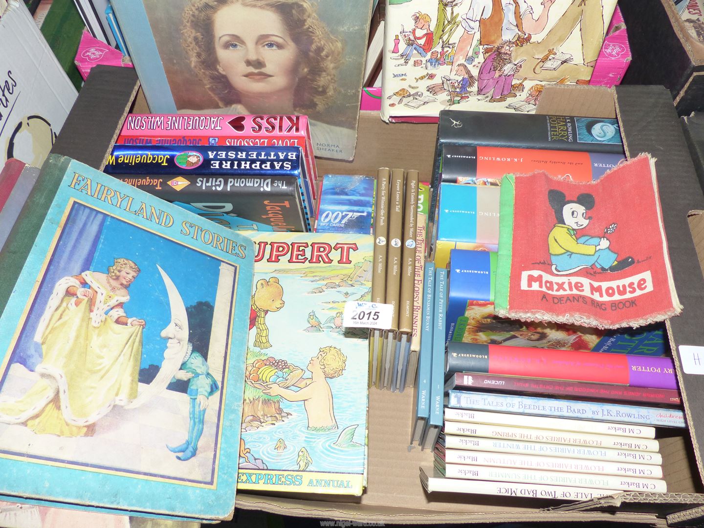 A box of Children's Books to include Harry Potter, Flower Fairies, The Tale of Peter Rabbit,