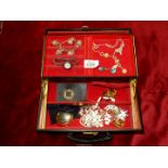 A black jewellery box and contents including; butterfly wing cufflinks, scarf clasps, necklaces,