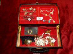 A black jewellery box and contents including; butterfly wing cufflinks, scarf clasps, necklaces,