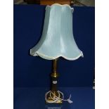 A brass table lamp, square based with duck egg blue shade, 20" tall excluding bulb and shade.