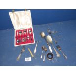 A small quantity of plated cutlery including cased set of teaspoons and a silver dessert fork,