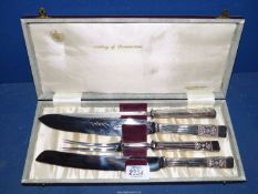 A cased carving set in 'Lady Katherine' design and including Bread knife.