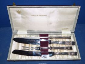 A cased carving set in 'Lady Katherine' design and including Bread knife.