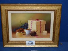A small Oil on board, depicting a still life with fruit, cake and present,