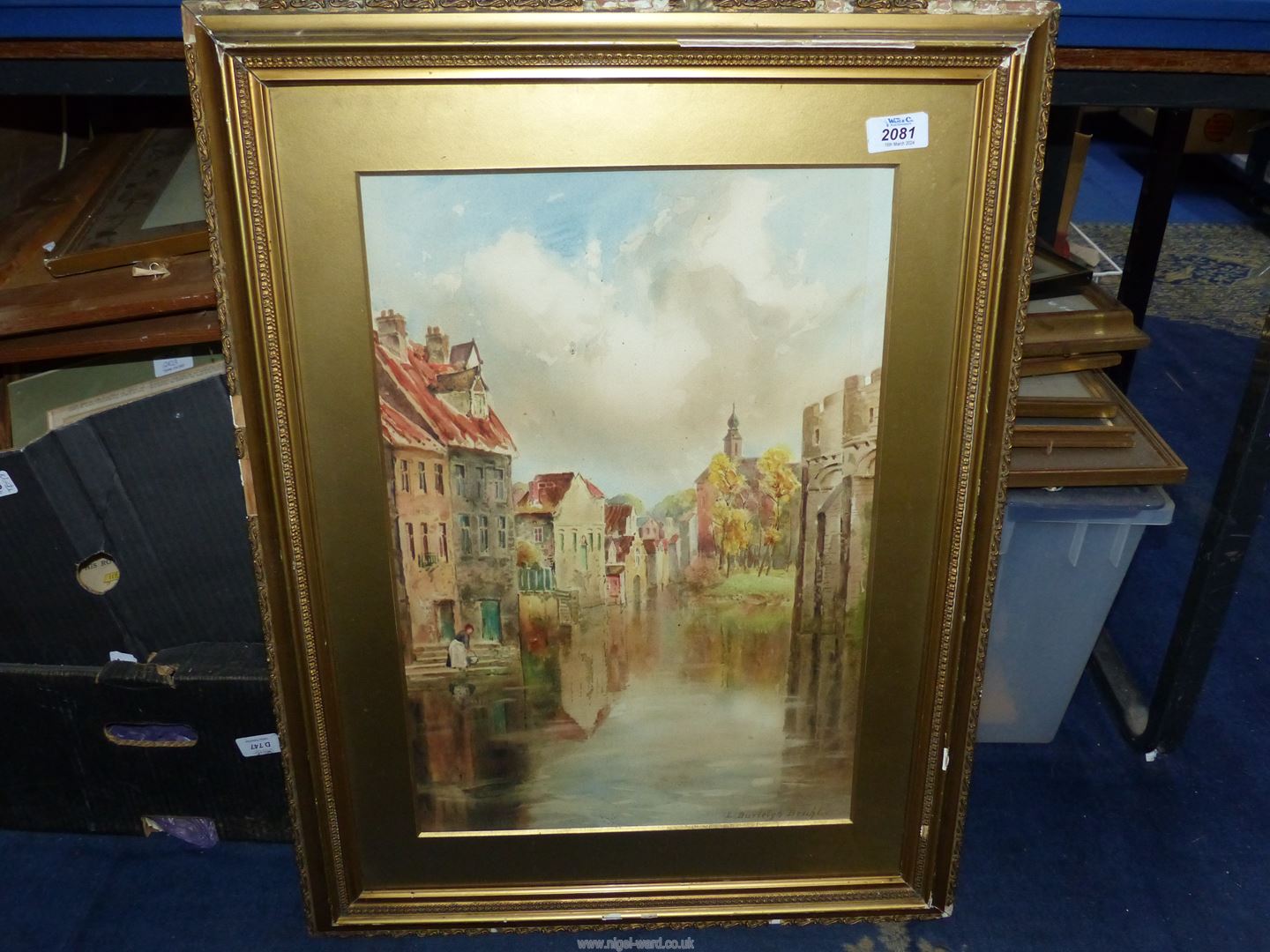 A framed and mounted Print of a Dutch inland waterway, signed lower right 'Louis Burleigh Bruhl',