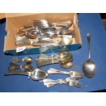 A quantity of mixed cutlery including spoons, forks, teaspoons, etc.