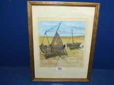 A framed Watercolour of two fishing boats on the shore initialed P.J.