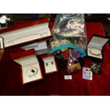 A quantity of costume jewellery including boxed bangles, clip-on earrings, beaded necklaces, etc.