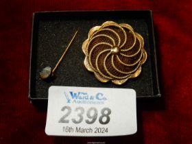 A gold Mourning brooch containing plaited hair and inscribed verso "She is not dead - 1st June