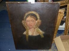 An unframed Oil on canvas portrait of a Lady in a bonnet, circa 1830, lined, unrestored,