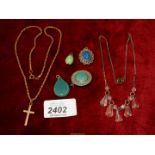 Six assorted jewellery pieces including pendants, chains and a brooch.