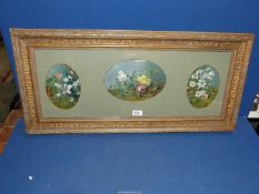Three floral Oil paintings framed together in oval mounts, no visible signature, 33" x 15 1/2".