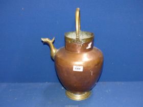A brass and copper water Vessel with spout.