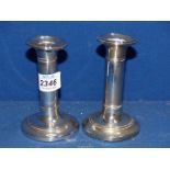 A pair of Silver Candlesticks with weighted bases, Birmingham 1904, makers I.S. Greenberg & Co.