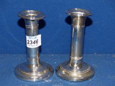 A pair of Silver Candlesticks with weighted bases, Birmingham 1904, makers I.S. Greenberg & Co.