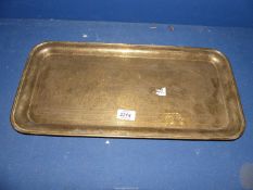 A rectangular Brass Tray profusely engraved with ten scenes form Eastern life,