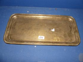A rectangular Brass Tray profusely engraved with ten scenes form Eastern life,