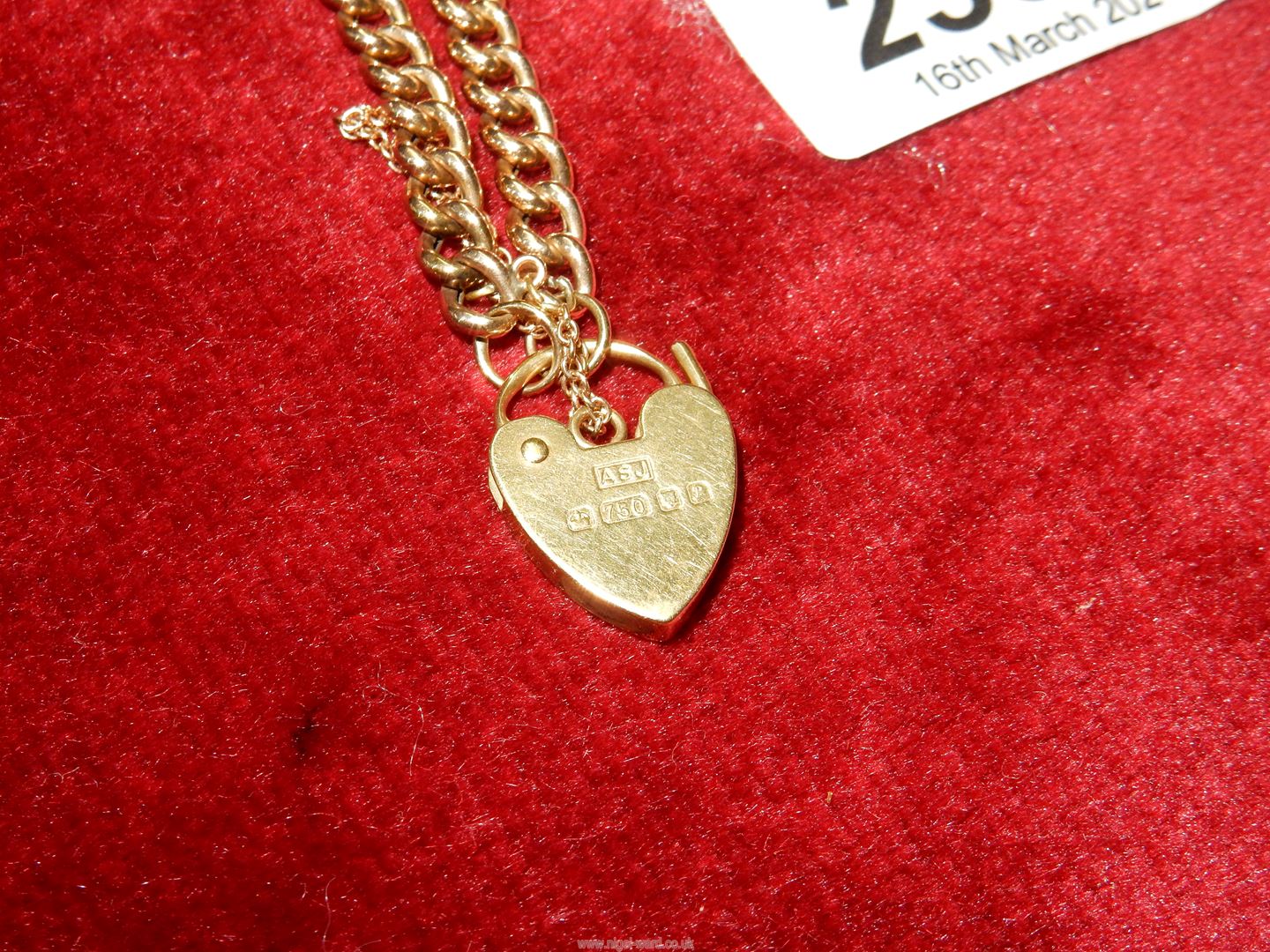 A yellow metal chain link bracelet with 18ct gold heart padlock (marked 750). - Image 2 of 2