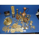 A box of brass and copper including copper jug, small candlesticks, horse brasses, etc.