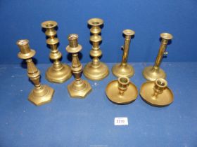 A small quantity of pairs of brass candlesticks and a pair of chamersticks.