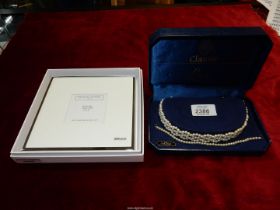 A Lotus pearl choker and matching bracelet, plus The White Company photograph frame.