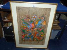 A framed and mounted Bark painting depicting colourful birds on branches with antelope figures
