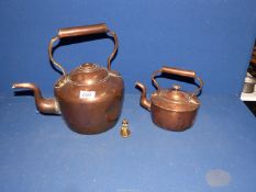 Two Copper kettles (one with finial missing) and a small handbell.