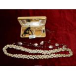 A small quantity of costume jewellery including shell necklace, iron, etc.