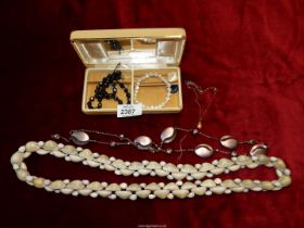 A small quantity of costume jewellery including shell necklace, iron, etc.