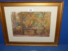 A framed and mounted Watercolour depicting a woodland scene with figures on a bridge,