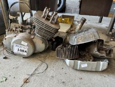 A partially dismantled Suzuki T500 unitary engine/gearbox and parts. Engine turns.