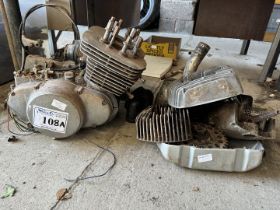 A partially dismantled Suzuki T500 unitary engine/gearbox and parts. Engine turns.