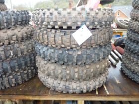Five of 19'' diameter aggressive tread pattern motorcycle tyres.