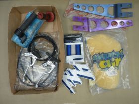 A box of brake/clutch levers, grips, control cables, brackets and a foam air filter.