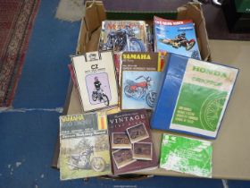 A quantity of motorcycle magazines and including manuals for Honda CBX 750F,