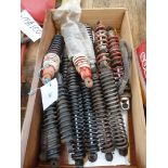 A quantity of shock absorbers/coil spring units.