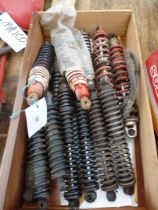 A quantity of shock absorbers/coil spring units.
