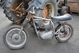 A BSA A65? motorcycle rolling chassis with an incomplete twin-cylinder, four-stroke,