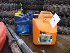 Two containers of Stihl Moto Mix fuel,