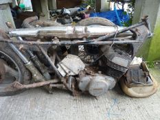 A Suzuki GT500 unitary engine/gearbox (twin cylinder, two-stroke, air cooled), frame, forks, wheels,