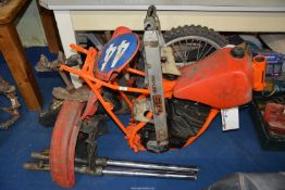An incomplete Honda CR480 motorcycle with a two-stroke, single-cylinder, air cooled engine,