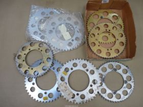 Eight various alloy rear wheel sprockets.