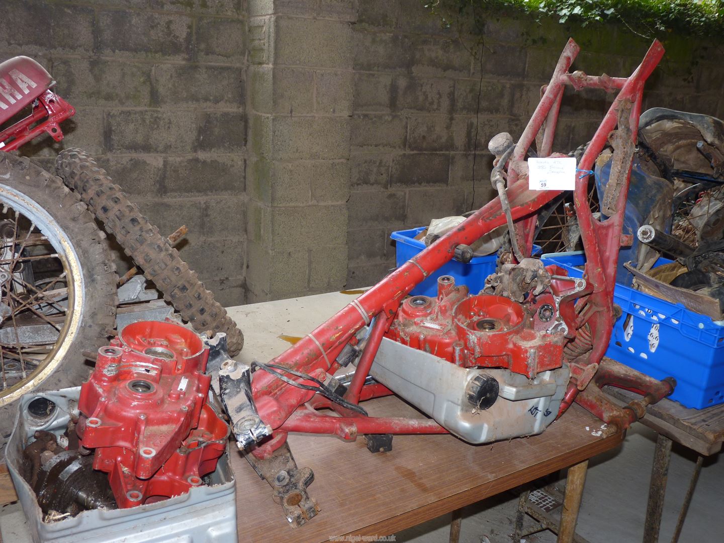 A Honda ATC frame and two engines (dismantled) Nos. TB06E/2118396 and TB06E/2116670.